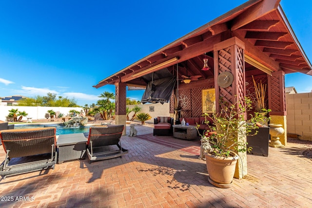 view of patio / terrace featuring a gazebo, a fenced backyard, and a fenced in pool