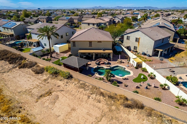 aerial view featuring a mountain view and a residential view