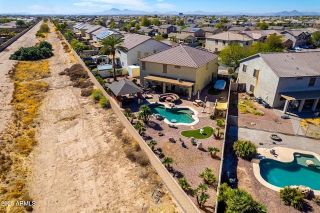 bird's eye view featuring a residential view and a mountain view