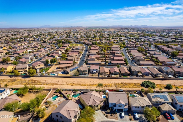 birds eye view of property featuring a mountain view and a residential view