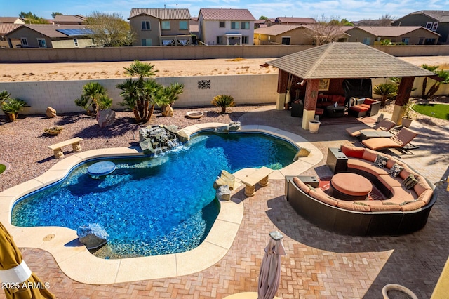 view of pool featuring a fenced in pool, a residential view, a fenced backyard, and a gazebo