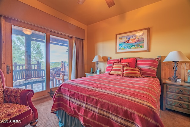 bedroom with access to exterior, ceiling fan, and dark carpet