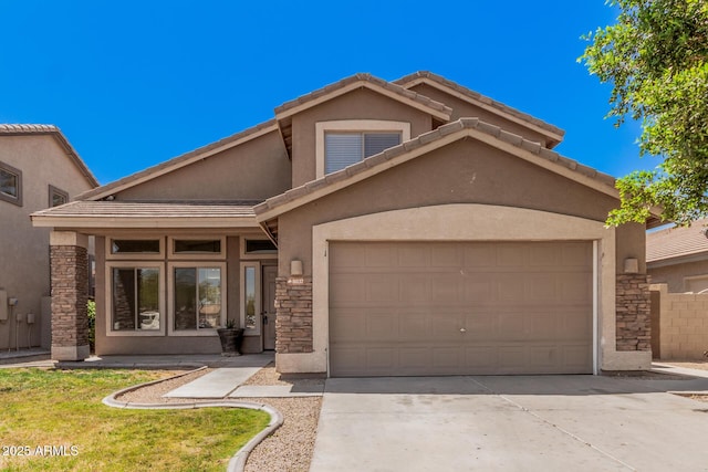 view of front facade with a garage, stucco siding, driveway, and stone siding