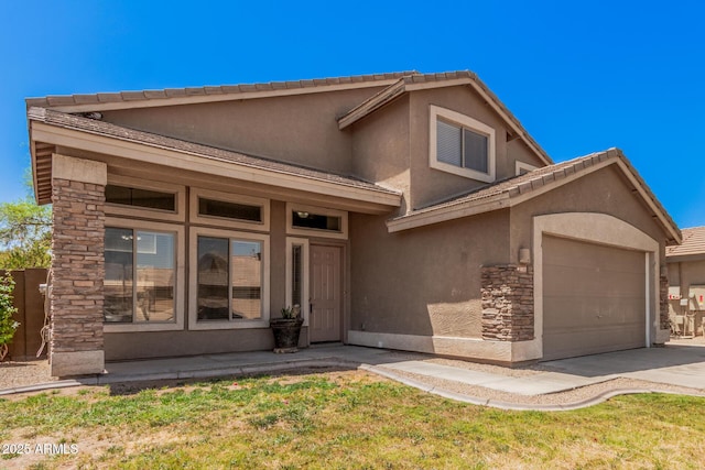 view of front of property with a garage, a front lawn, stone siding, stucco siding, and concrete driveway