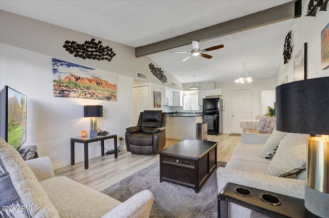 living room with light wood-type flooring, ceiling fan with notable chandelier, lofted ceiling with beams, and sink