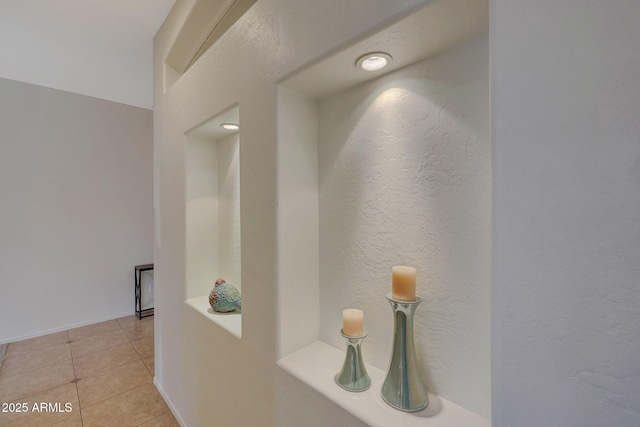 corridor featuring light tile patterned flooring