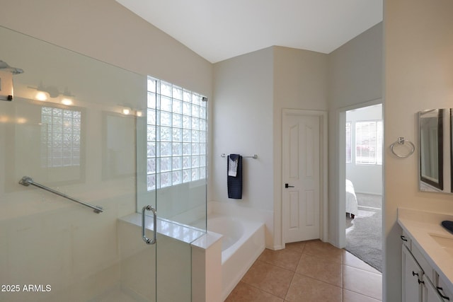 bathroom featuring plenty of natural light, a shower stall, ensuite bath, and tile patterned floors