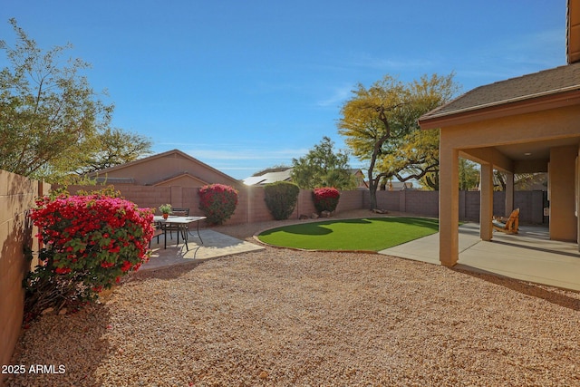 view of yard featuring a fenced backyard and a patio