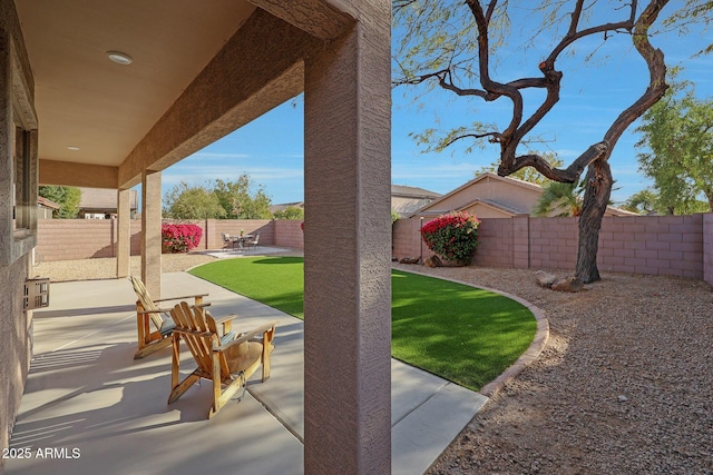 view of patio with a fenced backyard