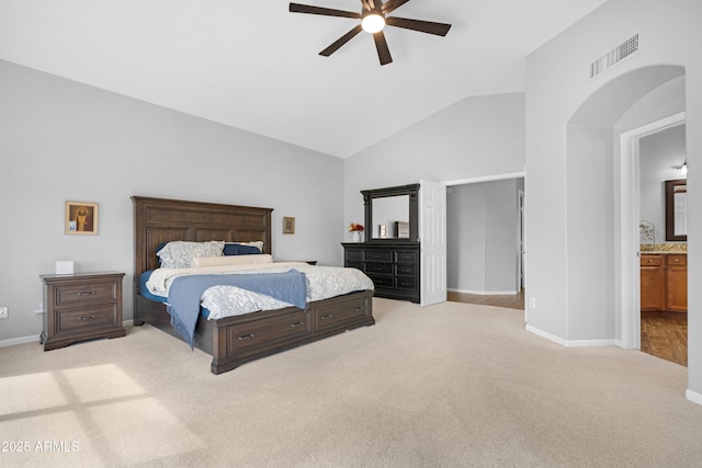 bedroom featuring light colored carpet, visible vents, a ceiling fan, vaulted ceiling, and baseboards