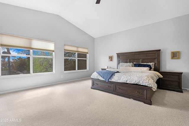 bedroom with a ceiling fan, lofted ceiling, and carpet