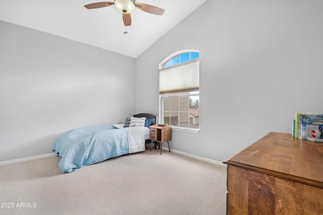 carpeted bedroom featuring vaulted ceiling, ceiling fan, and baseboards