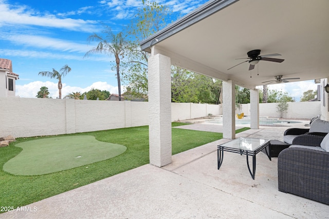 view of patio with a ceiling fan, a fenced in pool, and a fenced backyard