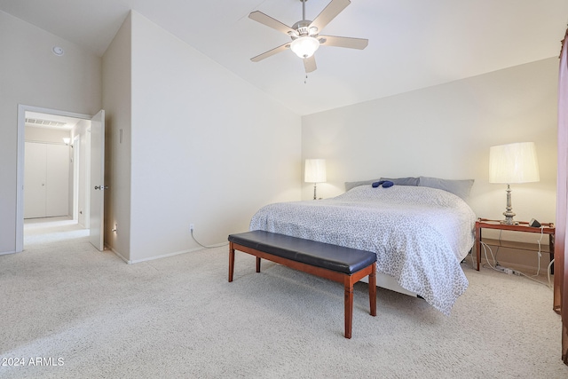 bedroom featuring high vaulted ceiling, light colored carpet, and ceiling fan