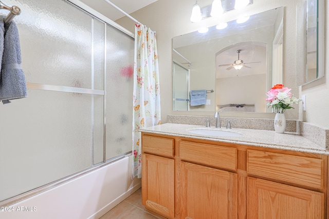 bathroom with vanity, shower / bath combo with shower curtain, ceiling fan, and tile patterned floors