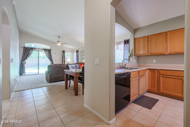 kitchen with dishwasher, light tile patterned flooring, vaulted ceiling, and ceiling fan