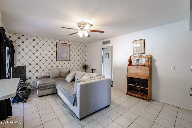 living room featuring ceiling fan and light tile patterned floors