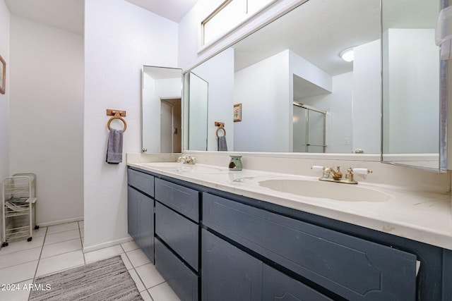 bathroom with walk in shower, tile patterned floors, and vanity