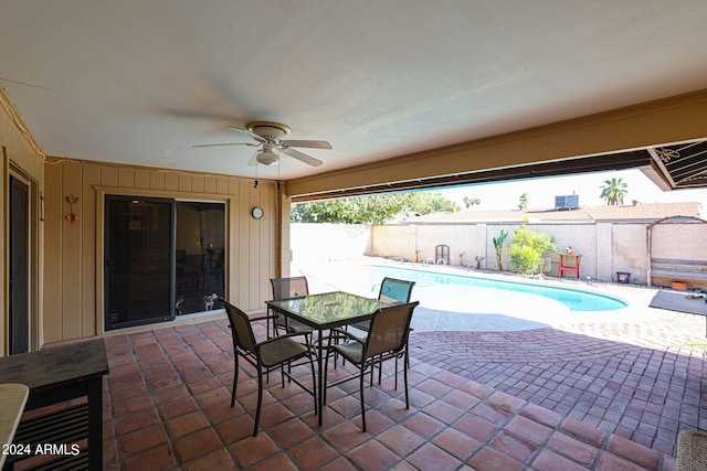 view of patio / terrace featuring a fenced in pool and ceiling fan