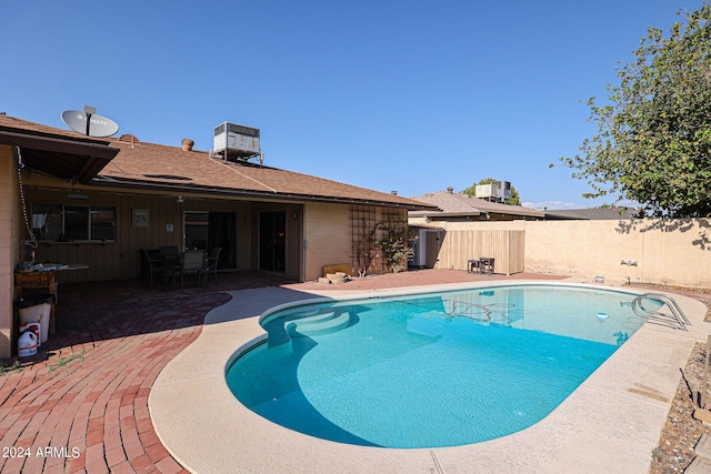 view of swimming pool featuring a patio area