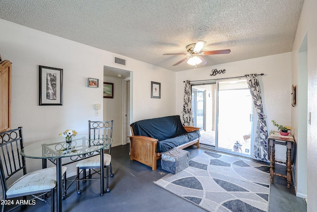 interior space featuring a textured ceiling and ceiling fan