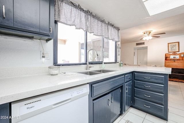 kitchen featuring kitchen peninsula, ceiling fan, dishwasher, light tile patterned floors, and sink