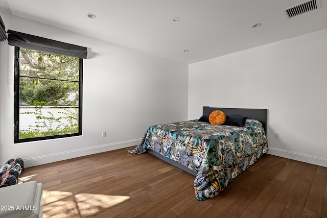 bedroom with hardwood / wood-style floors