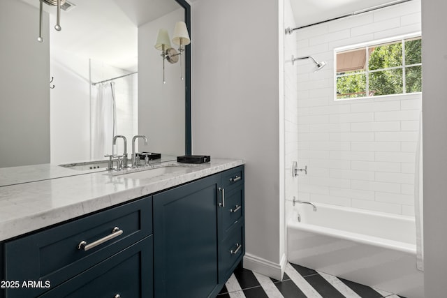 bathroom featuring vanity and shower / bath combo