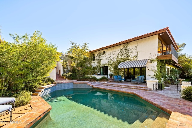 view of swimming pool with a patio area