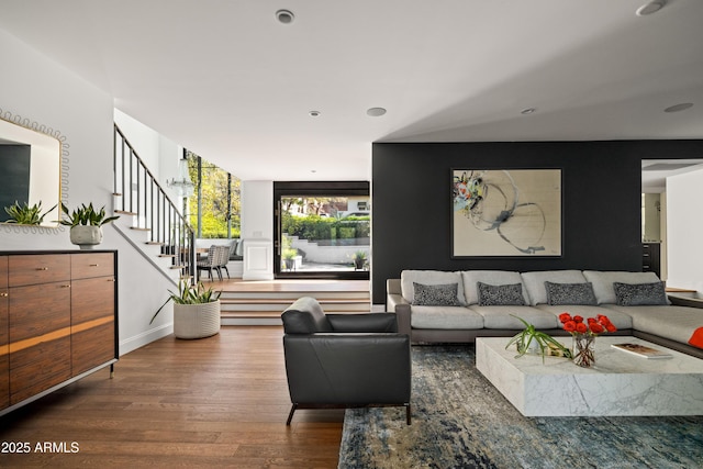 living room featuring dark hardwood / wood-style floors and expansive windows