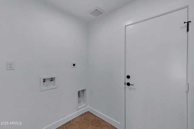 washroom with light tile patterned floors, laundry area, washer hookup, visible vents, and electric dryer hookup