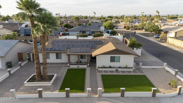 4202 W Purdue Ave, Phoenix, AZ 85051 - view of front of home with a residential view, roof mounted solar panels, stucco siding, and roof with shingles