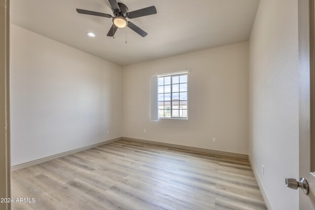 spare room with baseboards, recessed lighting, light wood-style flooring, and ceiling fan