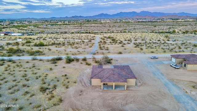 aerial view with a desert view, a mountain view, and a rural view