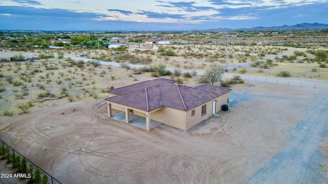 aerial view with a rural view, a mountain view, and a desert view