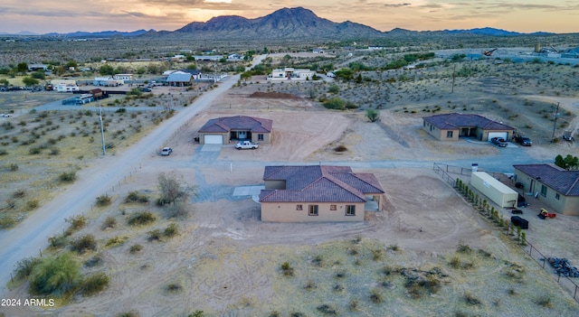 birds eye view of property featuring a rural view, a mountain view, and a desert view