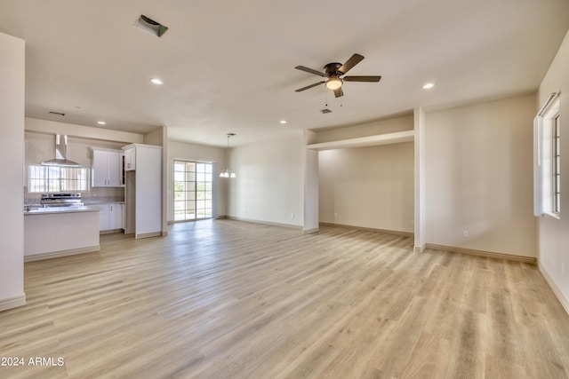 unfurnished living room featuring light wood-type flooring, a ceiling fan, and recessed lighting