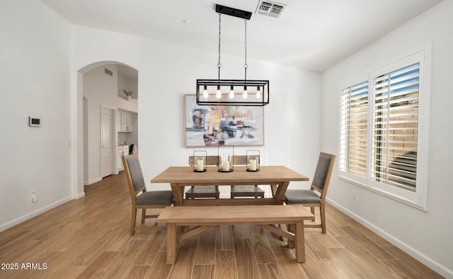 dining area with light hardwood / wood-style floors