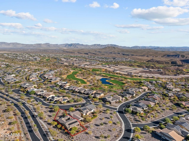 birds eye view of property with a mountain view