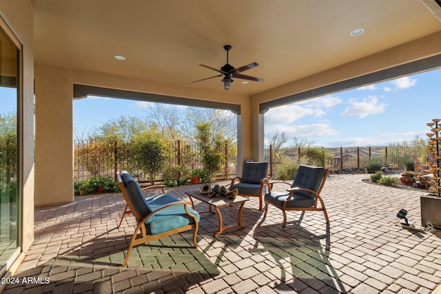 view of patio featuring ceiling fan