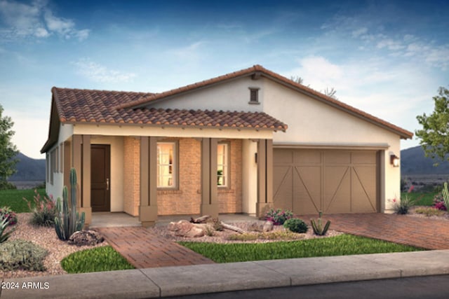 mediterranean / spanish-style home featuring a garage