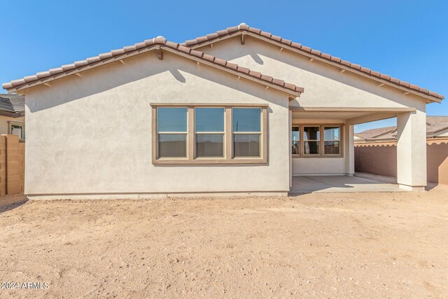 back of property featuring a patio area