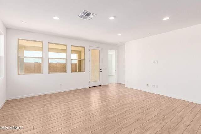 spare room featuring light hardwood / wood-style floors