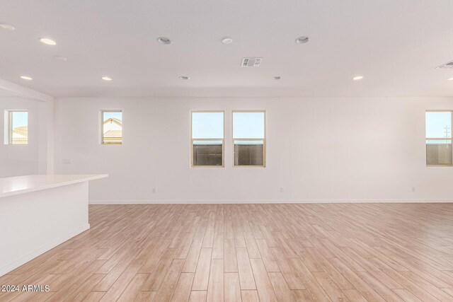 spare room featuring light hardwood / wood-style flooring