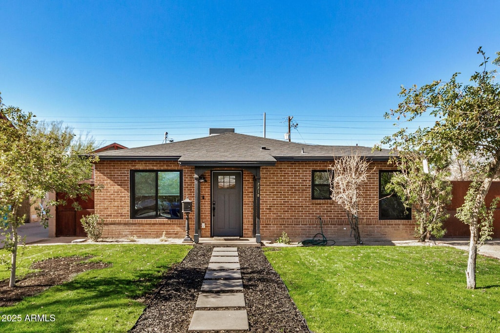 view of front of property with a front lawn