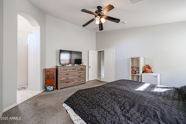 carpeted bedroom with ceiling fan and lofted ceiling