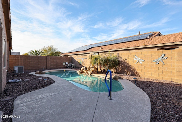 view of swimming pool with a patio and central AC unit