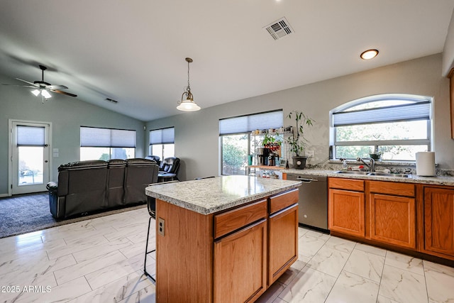 kitchen with dishwasher, sink, hanging light fixtures, a center island, and plenty of natural light