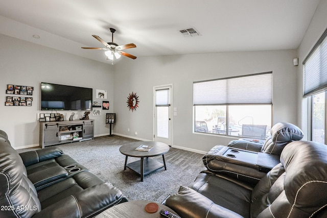 carpeted living room with ceiling fan and lofted ceiling