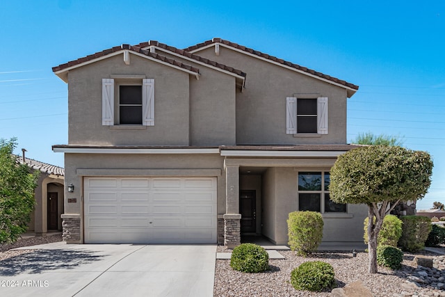 view of front of property with a garage